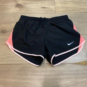 Black / Pink Nike track shorts.